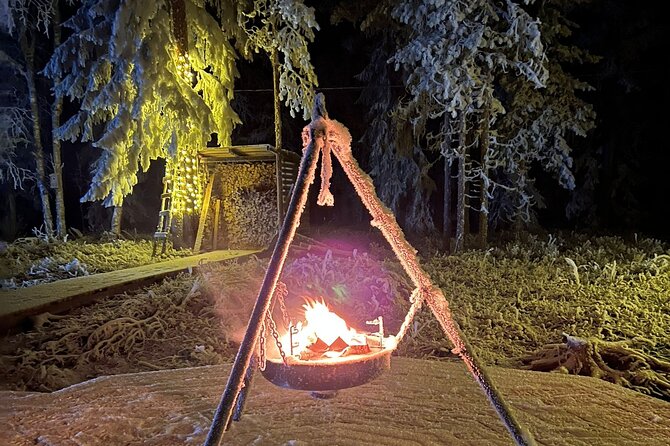 Glass Igloo Campfire Dinner under Northern Lights - Snowmobile on a frozen lake: the fun pivot after dinner