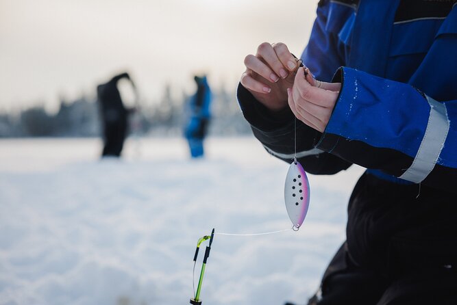 Ice Fishing and Snowmobile Safari Combo in Lapland - Ice fishing on a frozen lake: drilling is the real start