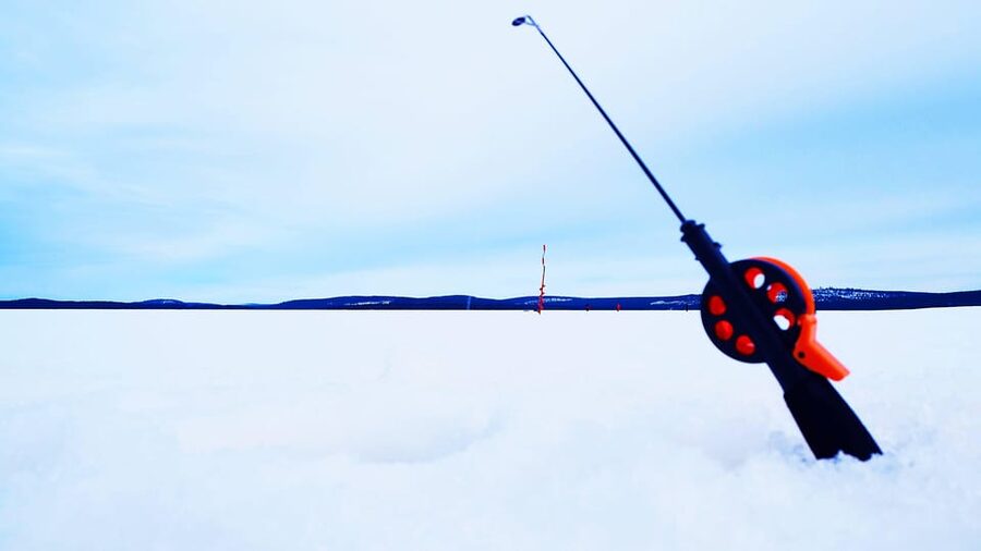 Ice fishing program in Lapland - The Open Fire Moment: Birch Woods, Warmth, and Food