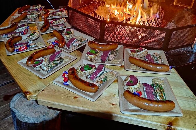 Lapland In A Day - Reindeer, Sledding, Snowmobile & Nature - Downhill sledding, snow slide fun, and a lantern-lit forest trail