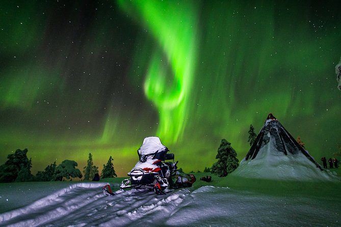 Northern Lights Snowmobile Sleigh Ride - Tepee campfire time: snacks, warm drinks, and an aurora-focused attitude
