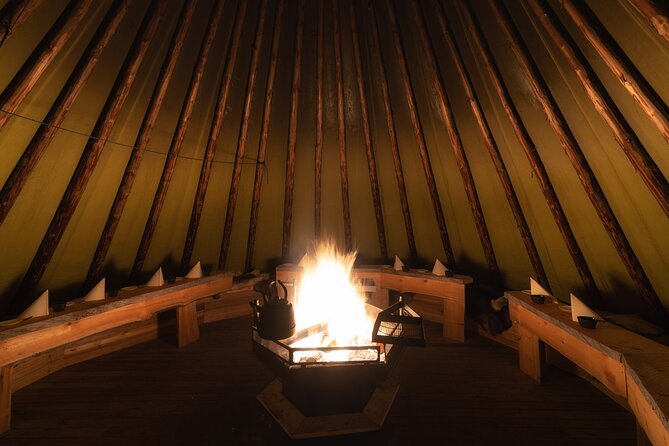 Northern lights tour to Lake Inari from Ivalo, Reindeers & Dinner - Island dinner by the open fire: Lapish teepee comfort after the chase