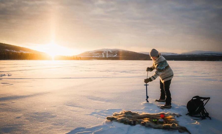 Pyhä: Ice Fishing Experience at Frozen Lake - Drilling the Hole and Dropping the Line Like Finns