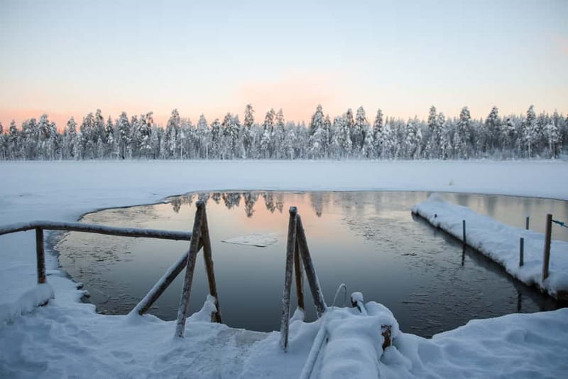 Rovaniemi: Arctic Ice Floating Experience - Suit up for zero-degree water without fear