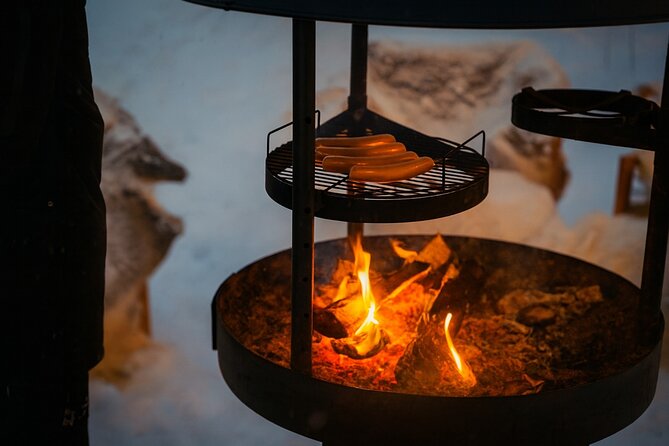 Rovaniemi: Drive New 2025 Snowmobiles - Aurora Adventure - The Bonfire Finish: Hot Drinks and Lapland Barbecue