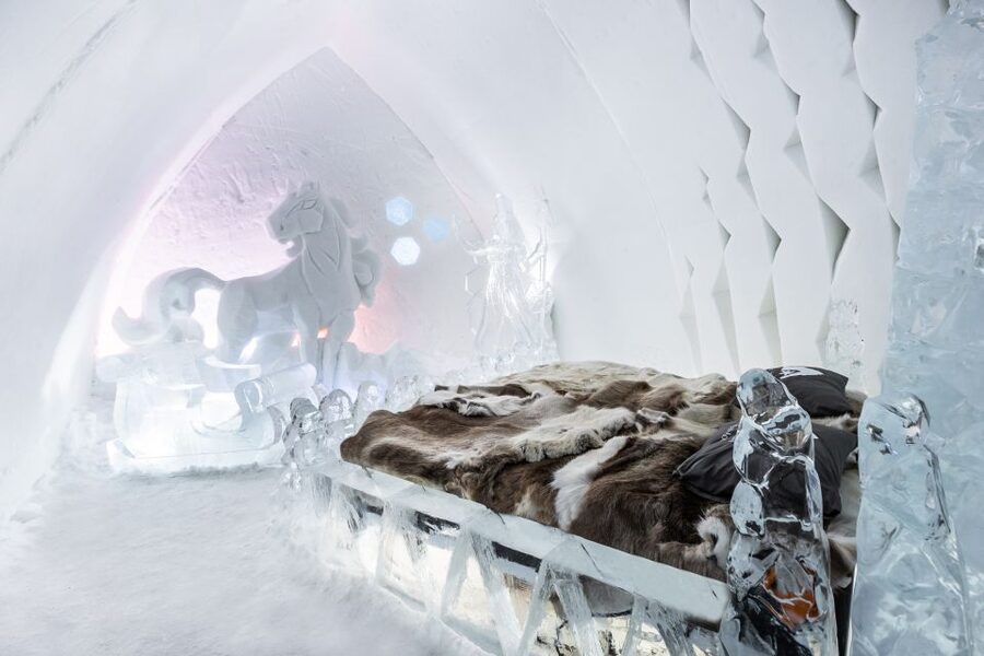 Rovaniemi: Snow Hotel Tour with Food by the Fire - Entering the SnowHotel: ice rooms that feel engineered, not gimmicky